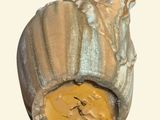 a small figurine that has a face on it