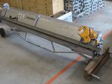 an image of a conveyor belt in a warehouse