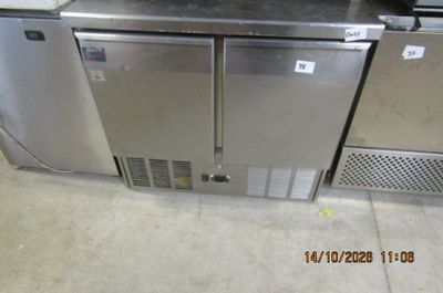two stainless steel refrigerators on display in a store