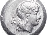 a close up of a coin with a woman ' s head on it