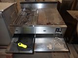 an image of a kitchen with a stove and a sink