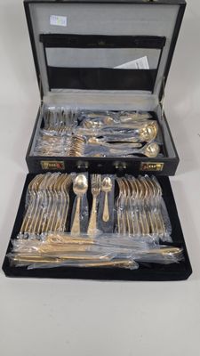 a case with silverware inside of it on a table