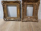 pair of antique gold picture frames on wooden floor