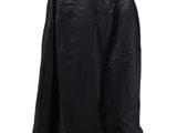 a black jacket hanging on a hanger on a white wall