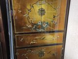 a cabinet that has been painted with flowers and birds