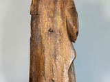 an image of a statue of a man in a brown robe
