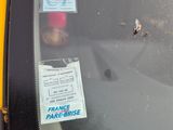 a sticker on the windshield of a car with a sticker on it
