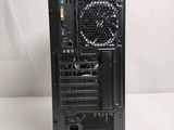 a black computer tower with a fan on top of it