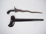 an image of a pair of old swords on a white surface