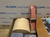 a box with a roll of cloth and a roll of tape in it