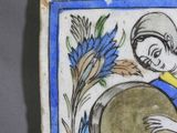 a picture of a tile with a woman holding a drum