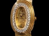 an image of a close up of a gold watch with a diamond bezel