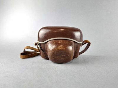 vintage brown leather camera case with strap