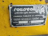 a sign on the side of a yellow wall