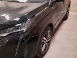 a black toyota harrier parked in a garage next to a wall