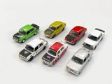 several toy cars are lined up in a row on a white surface