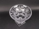 a glass bowl that has flowers inside of it