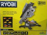 the box of the ryobi table top miter saw is open