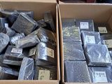a box full of different types of soaps and soap bars