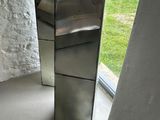 a mirror that is sitting on the floor in front of a window