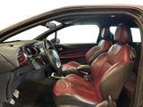 a picture of the interior of a car with red leather seats