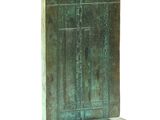 sculpture of a door on a stand with a white background