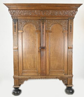 a large wooden cabinet with a door on top of it
