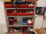 a garage with a lot of tools and boxes on the floor