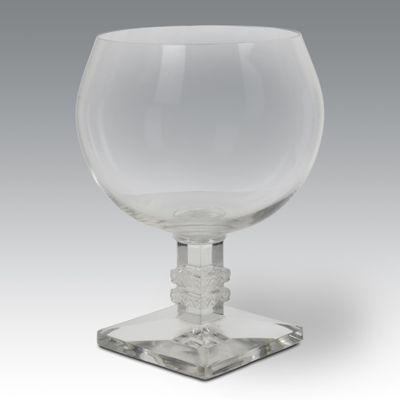 crystal goblet on a clear base on a grey background