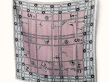 an image of a pink and black square scarf with black and white designs