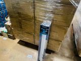 a large pile of boxes sitting on the floor in a warehouse