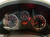 a close up of a car dashboard with various gauges
