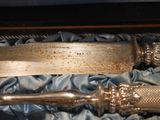 a knife in a box with a blue cloth