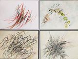 four different colored drawings of different shapes and sizes on a white surface