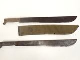 three knives are sitting on a white surface with a knife in the middle of them