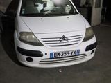 a picture of a white car parked in a garage
