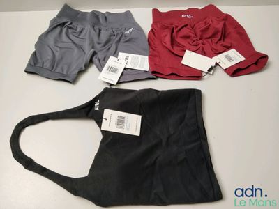 three pairs of men ' s athletic shorts are on a table