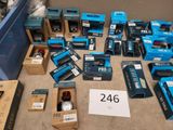 a lot of blue boxes of electronic equipment on the floor