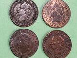 three different types of coins on a green surface