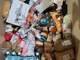 a cardboard box full of food and drinks in it
