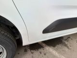 a close up of a white car with a black door handle