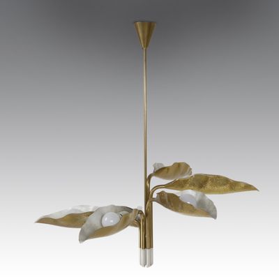 a gold and white chandelier with leaves hanging from the ceiling