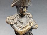 bronze figurine of a soldier holding a rifle and a dog