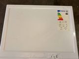 an image of a white refrigerator with a label on it