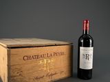 a wooden box with a bottle of wine next to it