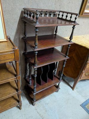 a wooden shelf with a mirror on top of it