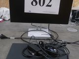 a laptop computer sitting on top of a table with a number sign on it