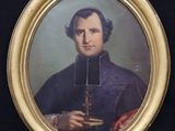 portrait of a man holding a candle in his right hand