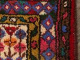 rug on the floor with a cat laying on top of it