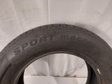 tire tread of a car on a white surface with a white background